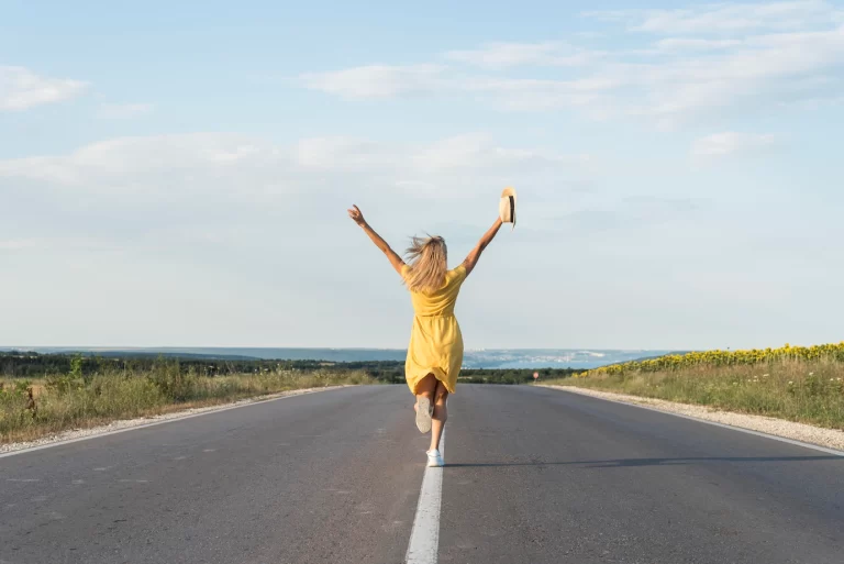 back-view-girl-running-middle-street_23-2148639813